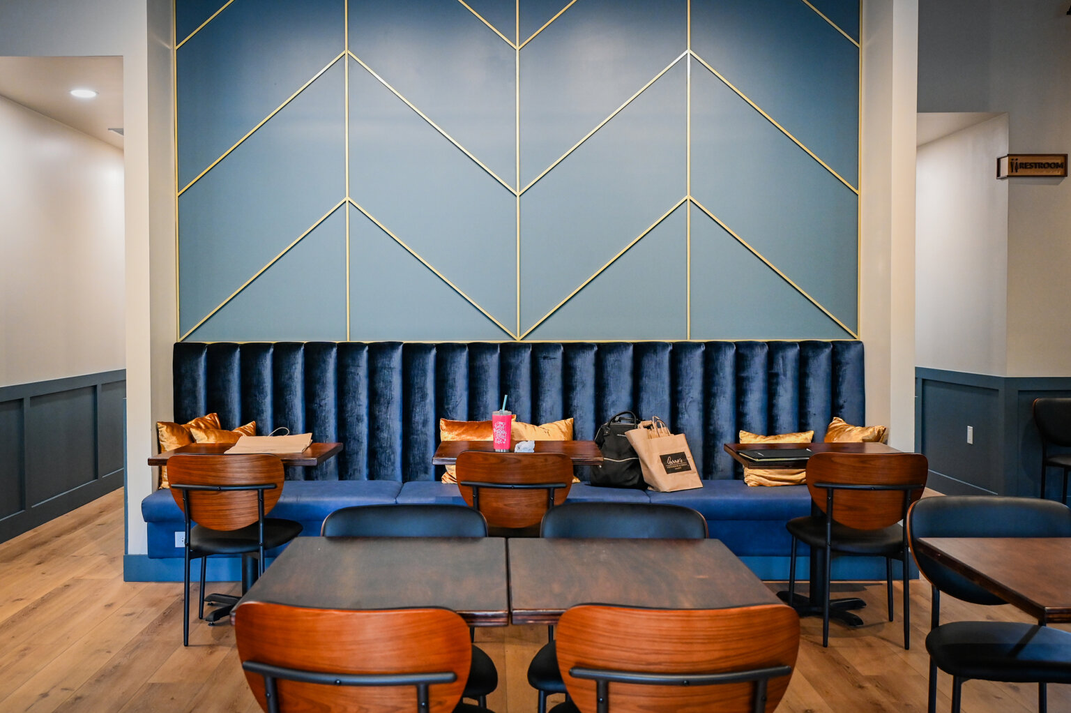 Stylish blue banquette seating at Purely Provisions
